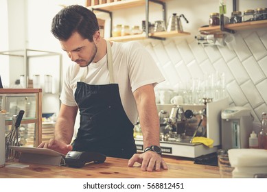 Cool Bartender Writing Check To Client In Coffee Room