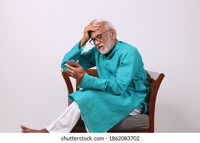 Cool Bearded Indian Old Man Using Mobile Phone For Video Call Or Taking Selfie – Happiness Elderly Lifestyle People Concept.