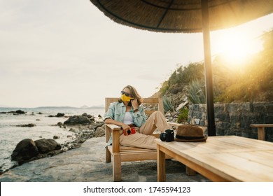 Cool Beautiful Girl Woman Traveler By The Sea With A Mask On Her Face, Stylish Outfit, Summer Travel 2020 Concept