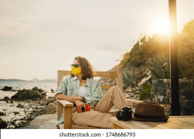 Cool Beautiful Girl Woman Traveler By The Sea With A Mask On Her Face, Stylish Outfit, Summer Travel 2020 Concept