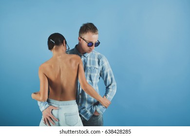 Cool Beautiful Young Couple. Stylish Teenager Couple. Portrait Of Young Couple In Love Posing At Studio. Happy Young Couple. No Brand.Fashion Colors. Love Concept. Secret.. Beautiful Woman And Guy.