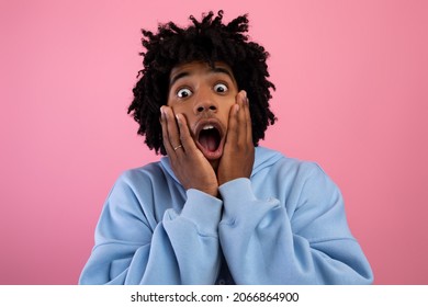 Cool Black Teen Guy Touching His Face, Screaming In Terror On Pink Studio Background. African American Adolescent Feeling Shocked Or Frightened, Expressing Emotion Of Fear