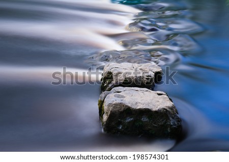 Cool blue stepping stones in a river