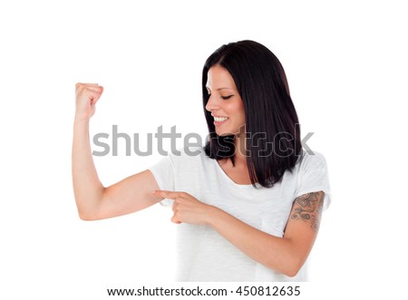 Cool brunette woman pointing her biceps isolated on white background