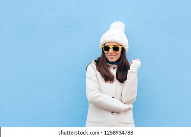 Cool Casual Fashion Winter Girl Wearing Sunglasses. Stylish girl in white outfit and yellow shades 
