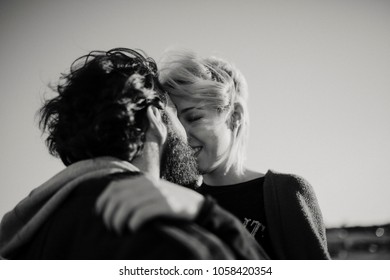 Cool Couple Kissing Outdoors In The City Suburbs. Black And White.