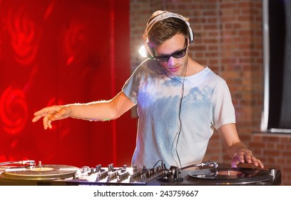 Cool Dj Spinning The Decks At The Nightclub