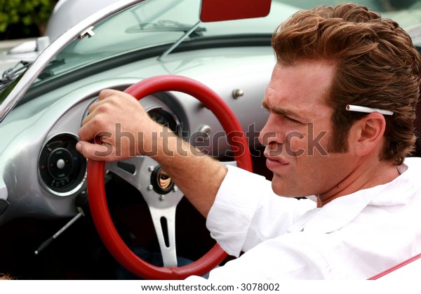 cool dude driving a sports\
car