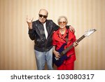 cool fashion elder couple with electric guitar