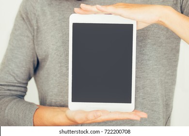 Cool girl holding digital tablet