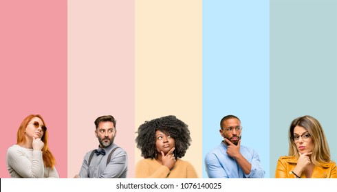 Cool group of people, woman and man doubt expression, confuse and wonder concept, uncertain future - Shutterstock ID 1076140025