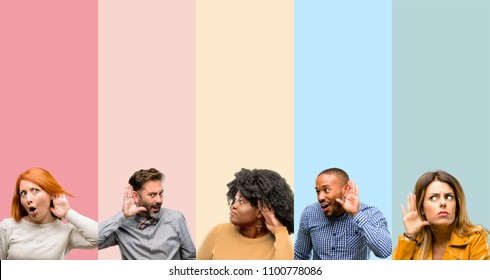 Cool group of people, woman and man holding hand near ear trying to listen to interesting news expressing communication concept and gossip