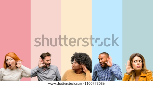 Cool group of people, woman and man holding hand\
near ear trying to listen to interesting news expressing\
communication concept and\
gossip