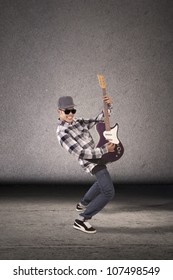 Cool Guitarist Playing Guitar. Shot In Studio.