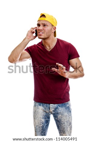 Cool handsome guy talking on the mobile phone. Isolated on white