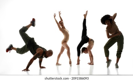 Cool Hip Hop Couple Dancing Breakdance Against Classical Elegant Ballet Couple. Concept Of Diversity Dancing Styles. Idea Of Choreography. Persons Isolated On White Background In Studio