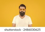 cool hipster man isolated on yellow. cool hipster man in studio. cool hipster man