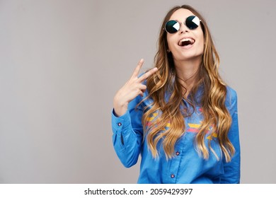 Cool hipster student woman wearing eyewear glasses . Caucasian female university student looking at camera smiling happy.