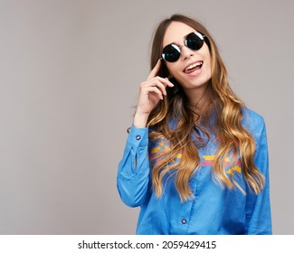 Cool hipster student woman wearing eyewear glasses . Caucasian female university student looking at camera smiling happy.