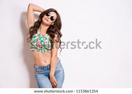 Similar – Woman with sunglasses looking at camera over garden fence