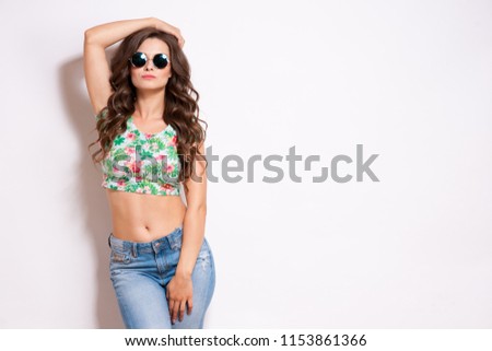 Similar – Woman with sunglasses looking at camera over garden fence