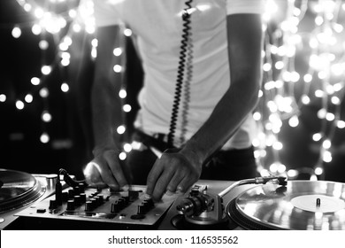 a cool male dj on the turntables