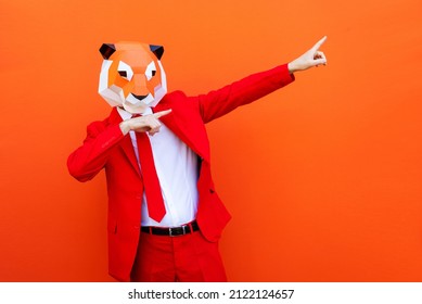 Cool man wearing 3d origami mask with stylish colored clothes - Creative concept for advertising, animal head mask doing funny things on colorful background - Shutterstock ID 2122124657