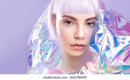 Cool Modern Young Girl With Ideal Brows, Purple Hair And Perfect Makeup, Healthy Glowing Skin, Blond Short Hairs In Colourful Iridescent Foil. Creative Portrait Of Blonde, Ad Of  Make Up Products.