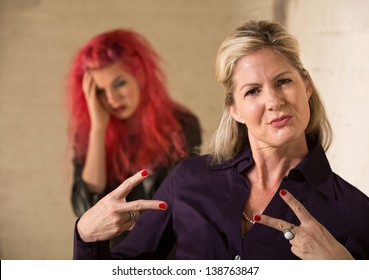 Cool Mother Making Hand Gesture With Embarrassed Teenager