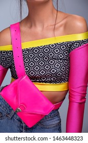 Cool Retro Fashion Look, Young Woman Model Wearing Colorful Fanny Pack And Long Sleeve Fancy Top, Outfit Details. Pink Beltbag