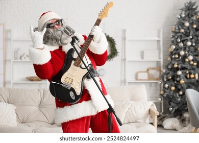 Cool Santa Claus with guitar and microphone singing at home - Powered by Shutterstock