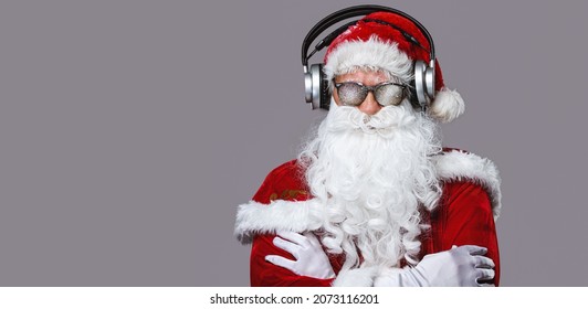 Cool Santa Claus Is Listening Music In Headphones