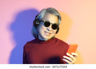 The Cool Senior Asian Man In The Gel Color Light Photography.