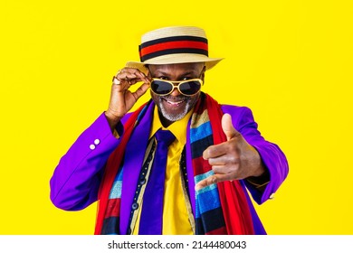 Cool senior man with fashionable clothing style portrait on colored background - Funny old male pensioner with eccentric style having fun - Shutterstock ID 2144480043
