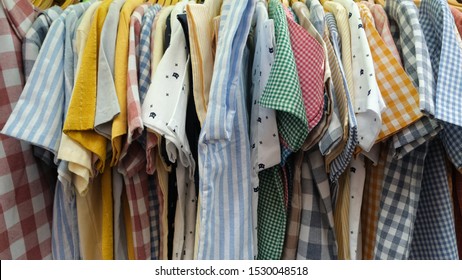 Cool shirts hang on rack at fashio store
