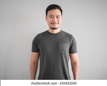 Cool smile face and pose of confidence Asian man with beard.