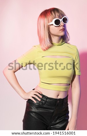Cool teenage girl in neon yellow bandage crop top street apparel photoshoot