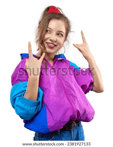 Cool teenager. Fashionable DJ girl in colorful trendy jacket and vintage retro sunglasses enjoys style of 80s-90s vibes. Teenager at disco party. Young fashion model isolated on white background.