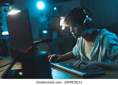 Cool Teenager Wearing Headphones And Playing Online Video Games, Gaming And Entertainment Concept