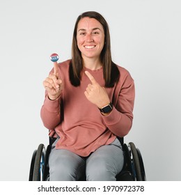 Cool Woman On A Wheelchair With A Vote Sticker On Her Index Finger