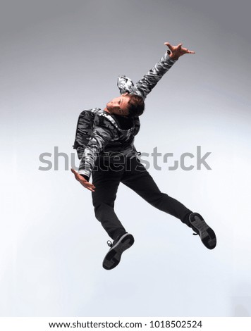 Cool young break dancer isolated on white background