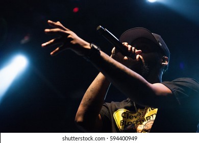 Cool Young Rap Singer With Microphone. Rapper With Mic Singing On Concert Stage In Night Club. Portrait Of Vocalist Performing On Scene In Nightclub. USA - 1 MAY,2022