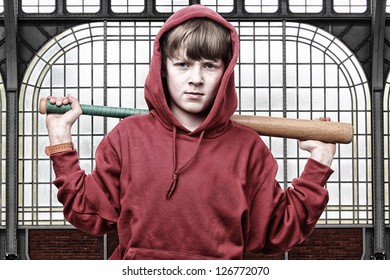 Cool Young Teenage Boy With A Baseball Bat