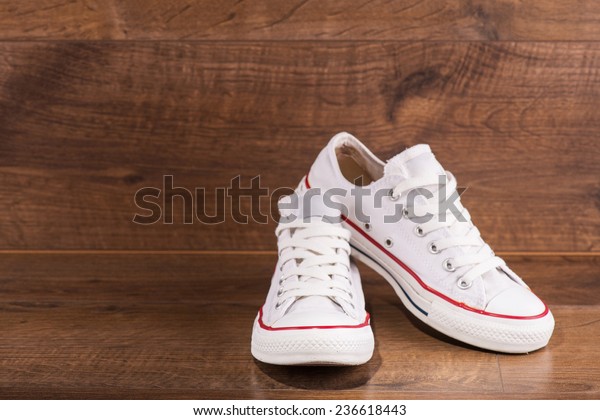 white shoes with red stripe