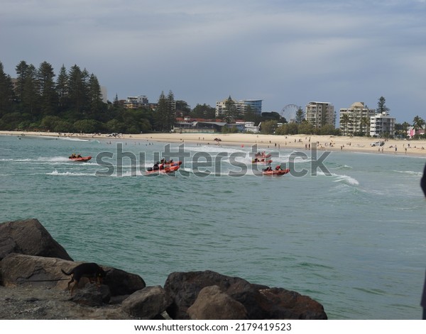Coolangatta QLD Australia July 03 2022: Large\
crowd fill the beach at the Surf Boat rescue championship titles\
held at the popular tourist destination Coolangatta Gold Coast QLD\
Australia