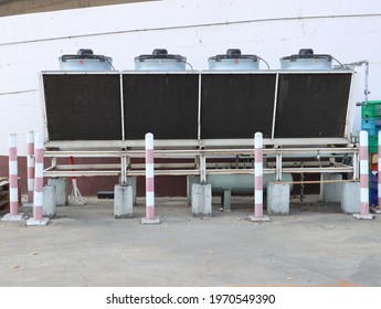 Cooling Air Conditioning Unit On Concrete Flor Next To The Wall.