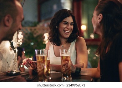 Cooling Down With Close Friends. Cropped Shot Of Three Friends Having Beers In A Bar.