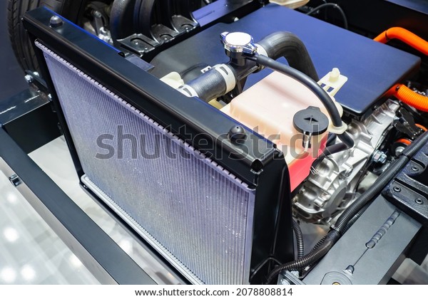 Cooling
radiator inside car. Car radiator inside dismantled bonnet. Inside
car. Concept - filter replacement. Installing new cooling filter.
Engine cooling system repair. Car
repair.