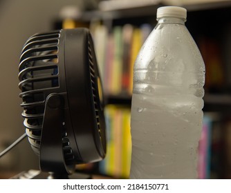 Cooling Room On Hot Days. 
Fan Blows Air Into A Bottle Of Ice Water, Diy Home Made Air Conditioning. Stay Cool In Hot Weather. Avoid Heat Stroke. Life Hack. Hot Summer Day Tips. Keep Temperature Low