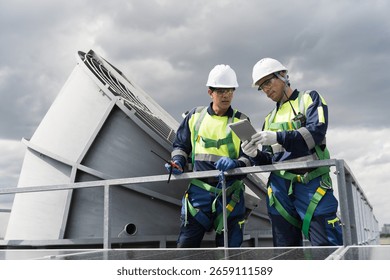 Cooling tower. Engineer or technicians maintenance and repair of cooling towers on rooftop of building